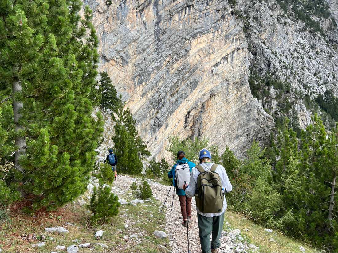 Hikers descending from the Pejë Pass to the Theth Valley |  Kate Baker