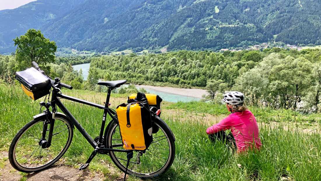 Cyclist taking in the view on the Alpe Adria Cycle Path