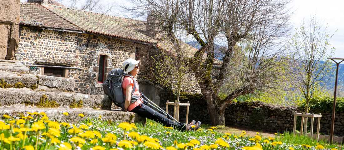 A pilgrim rests near Aubrac on the Le Puy Camino in France