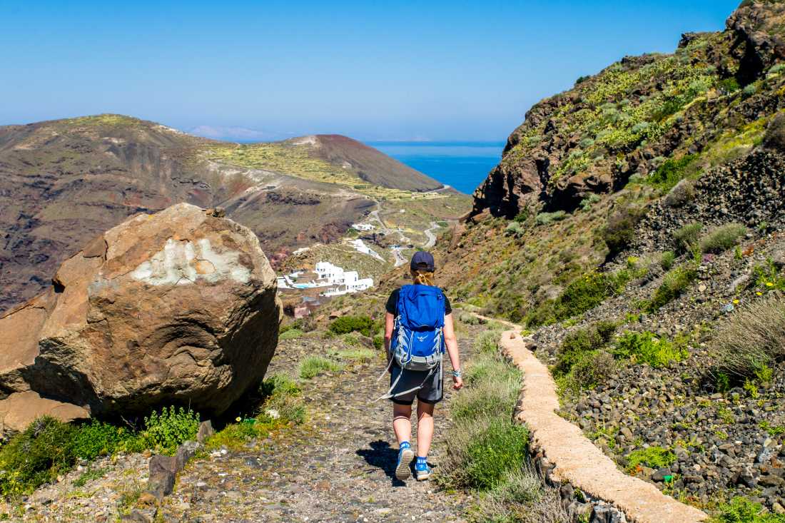 Follow the mountain road to Oia on Santorini and take in the famous blue-domed churches, and whitewashed houses.