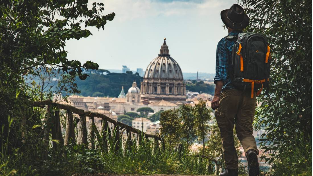 Pilgrim walking into St Peters in Rome at the end of the Via Francigena | <i>Tim Charody</i>