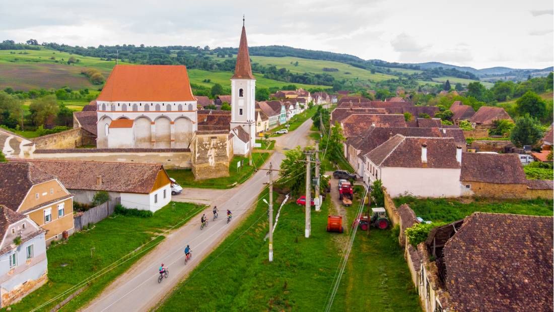 Cycling through a village in Transylvania