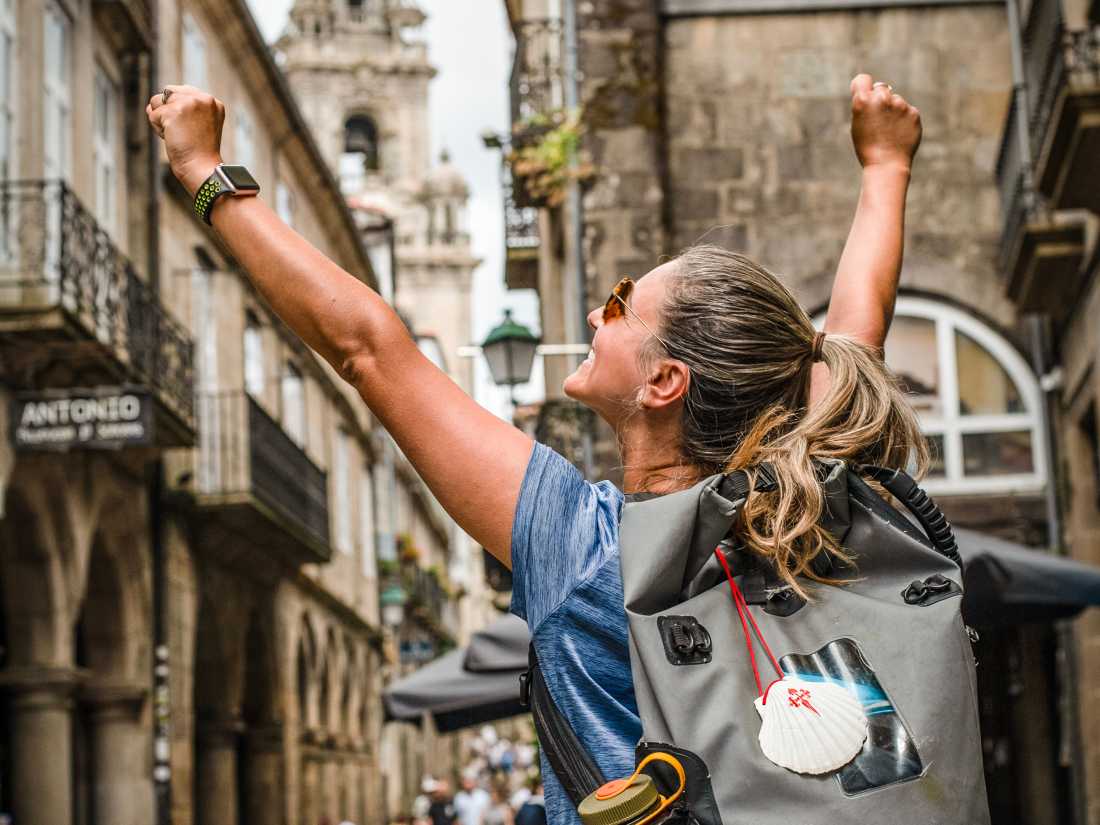 Celebrating the finish at Santiago de Compostela Cathedral |  Tim Charody